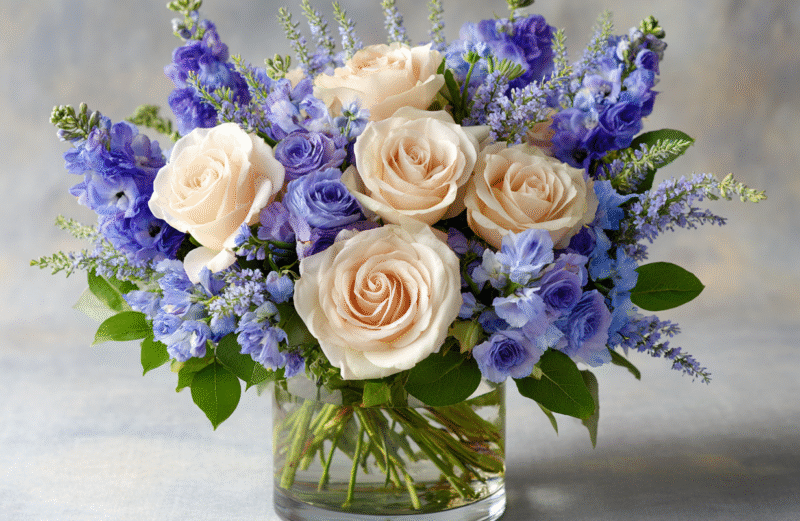 roses rununculus delphinium arrangement for sympathy funeral occasion (1)